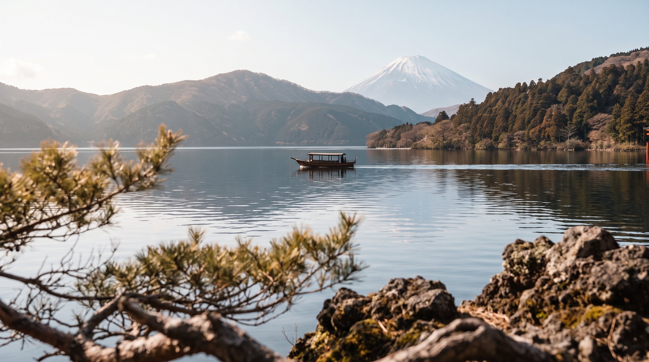 A sightseeing boat on Lake Ashi in Hakone with Mt. Fuji in the distance