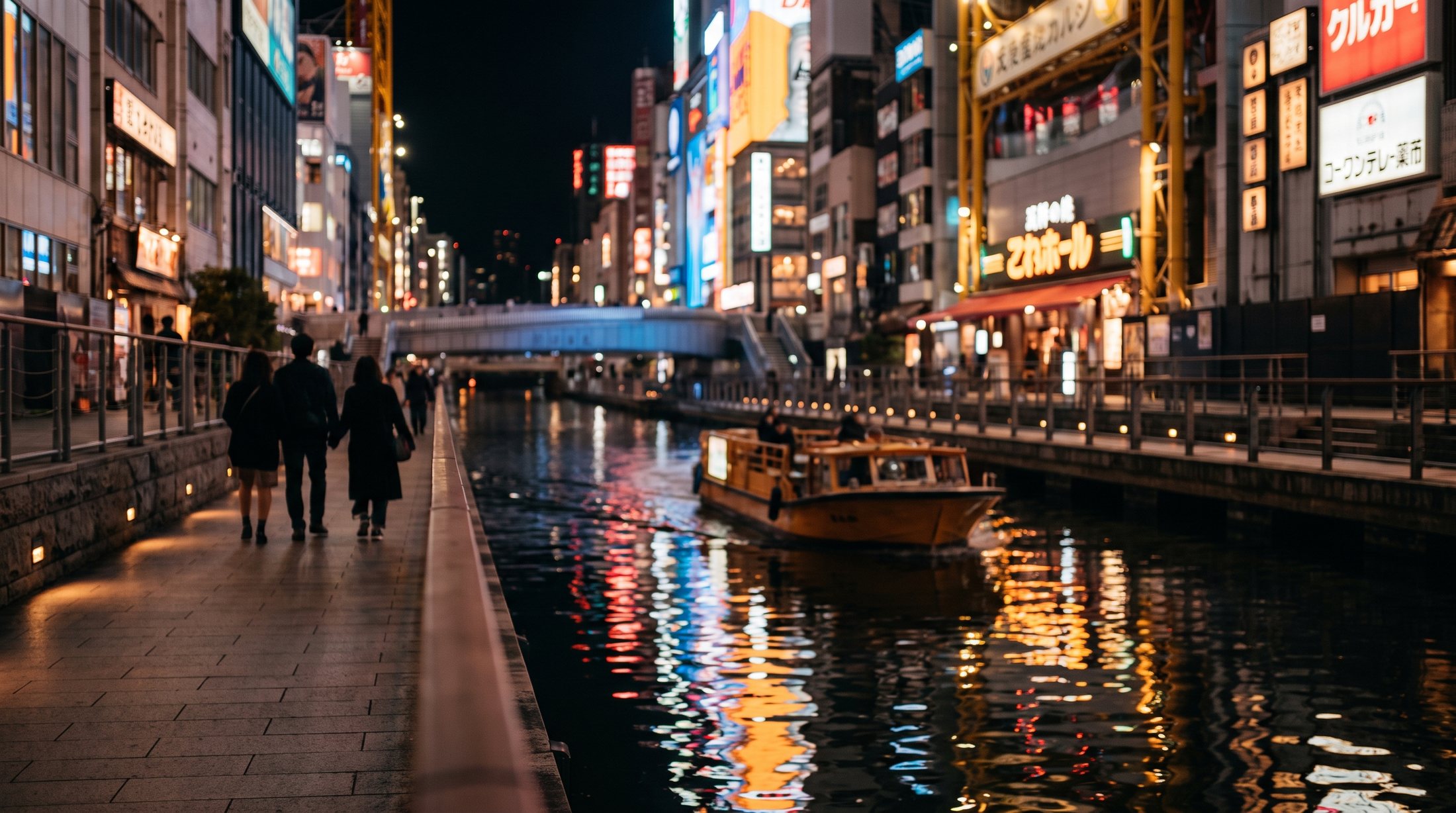 The Dotonbori canal in Osaka glowing with neon signs at night